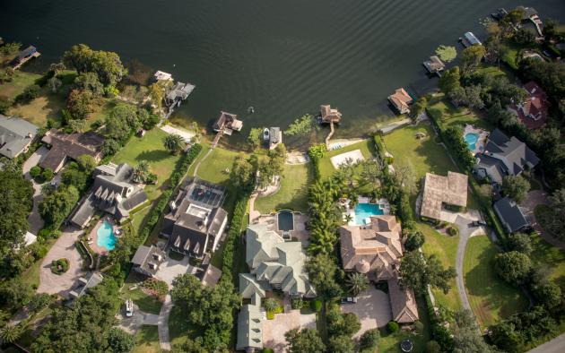 aerial view of large houses by lake in Orlando, Fla.