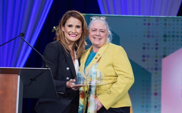 Florida Realtors President Christina Pappas presents 2021 President Cheryl Lambert with the 2022 Realtor of the Year award