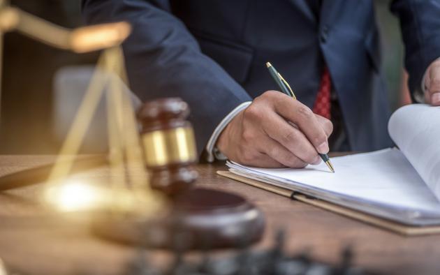 Man signing paperwork