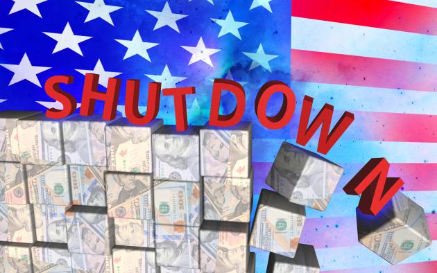 The word shutdown toppling off money with a flag in the background