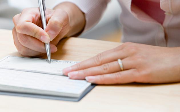 florida realtors pac logo with image of woman writing check