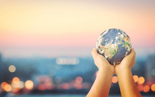 hands holding a globe