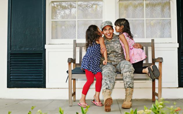 veteran family on bench on porch