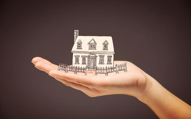 illustration of hand holding a house 