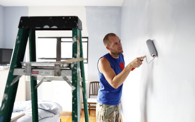 man painting a wall