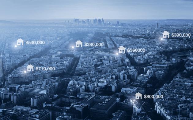 photo illustration of housing prices on aerial image of city