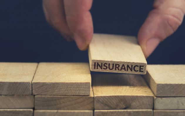 Blocks with one that says insurance