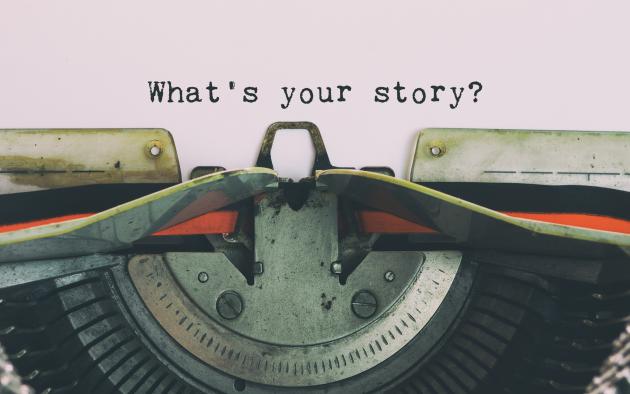 typewriter with words "what's your story?"