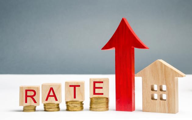 Coins and the word rate show home mortgage rate increases