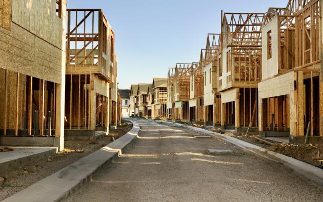 Street lined with homes under construction