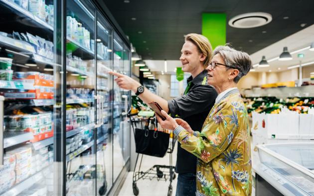 Grandmother and grandson shopping for groceries