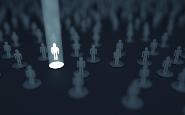 photo illustration of crowd with one person in the spotlight