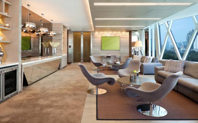 Gathering room with chairs and service areas located on a high floor in Miami