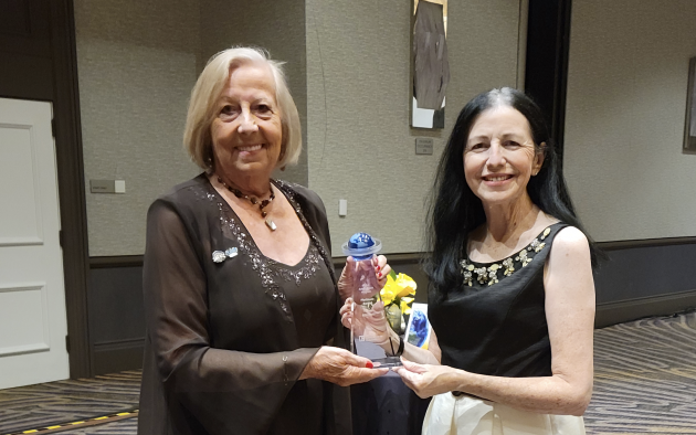 Christel Silver and Maria Grulich hold NAR's Global Platinum Award