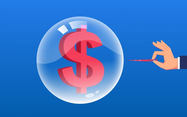 Balloon with a dollar sign being poked with a pin