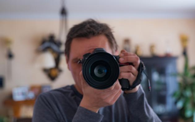 Camera faced toward viewer with living room in background