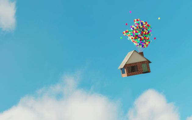 House floating in the sky and held up by balloons