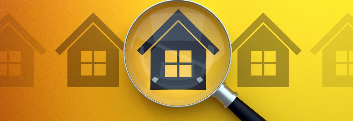 magnifying glass over middle house in row of flat house images on yellow background