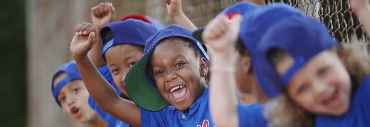 Youth baseball players cheering