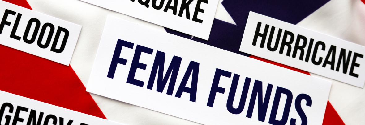 the words FEMA funds in a box appear on an American flag