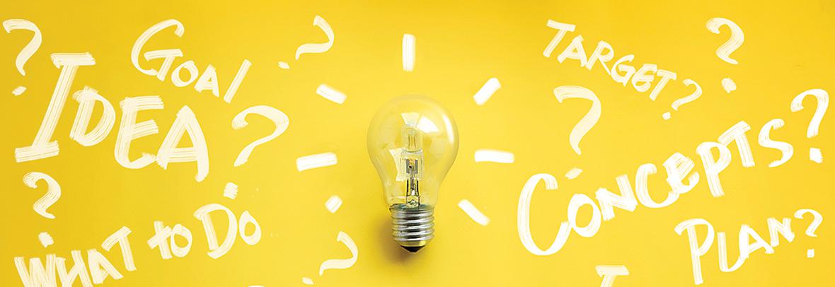 Photo illustration of a light bulb with white writing around it on yellow background