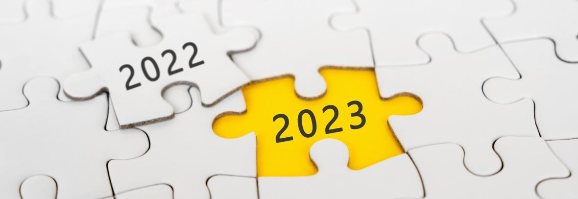 White jigsaw piece saying 2022 has 2023 underneath after removed