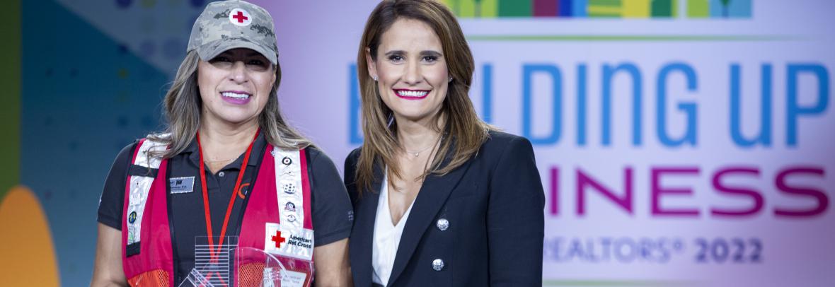 Katiuska Villamizar holds 2022 Humanitarian of Year Award beside Florida Realtors Pres. Christina Pappas