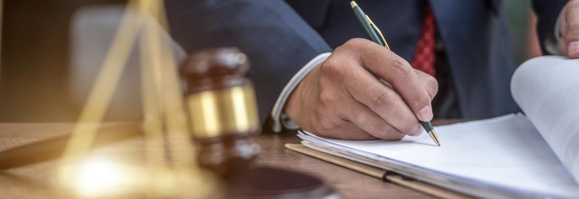 Man signing paperwork