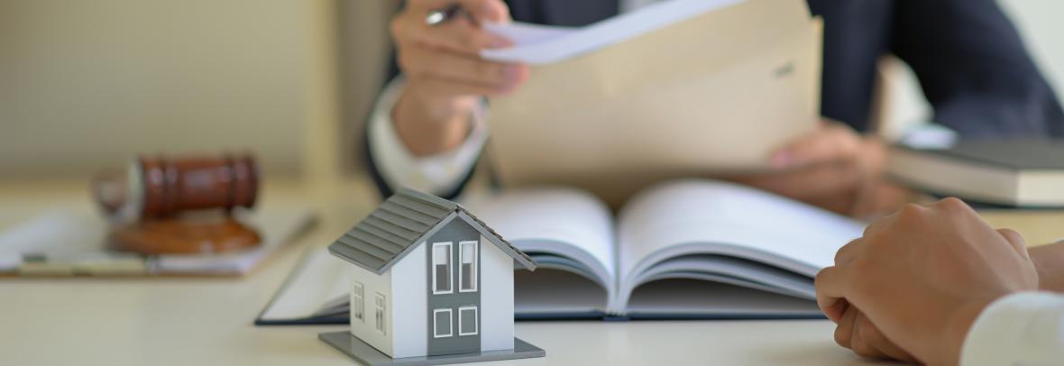 Closeup of photo a man holding paperwork at a desk