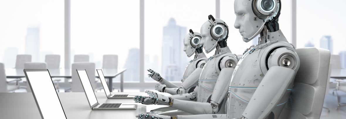 Line of robots sits in front of laptops with phones to their ears