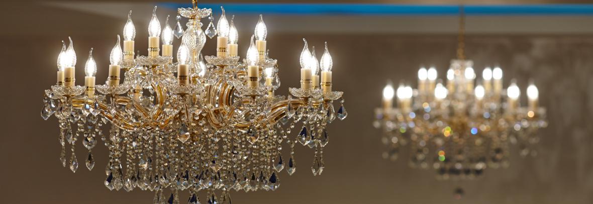 A large crystal chandelier with lights on