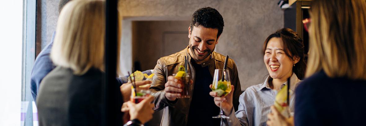 A group of business colleagues celebrating at happy hour