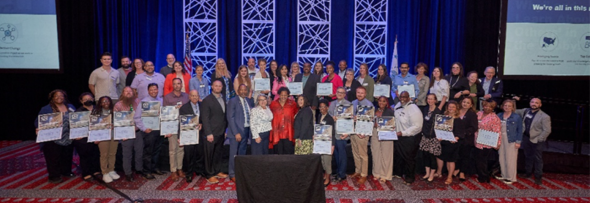 Large group photo of the fair housing groups representatives that will receive the latest HUD awards