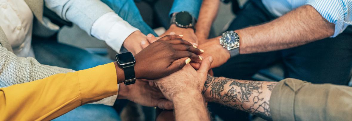 diverse hands in a circle