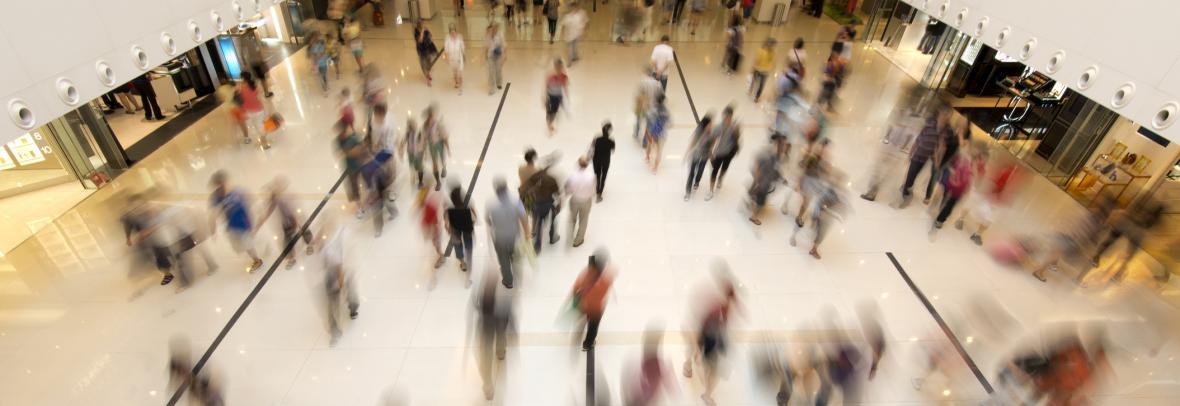 blurred photo of people in a shopping center