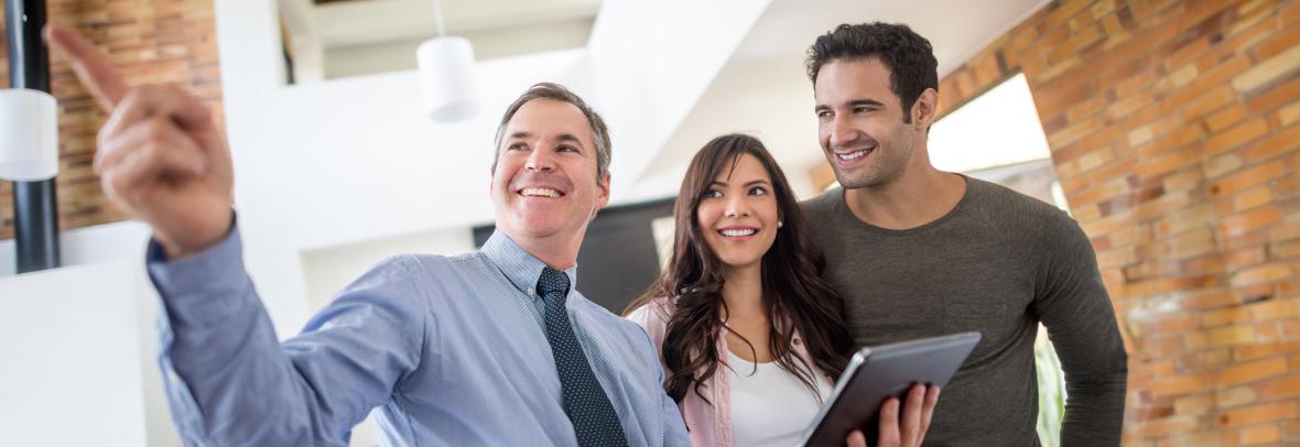 Realtor showing a couple a home