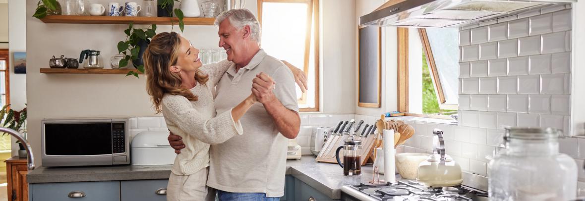 older couple dancing in kitchen
