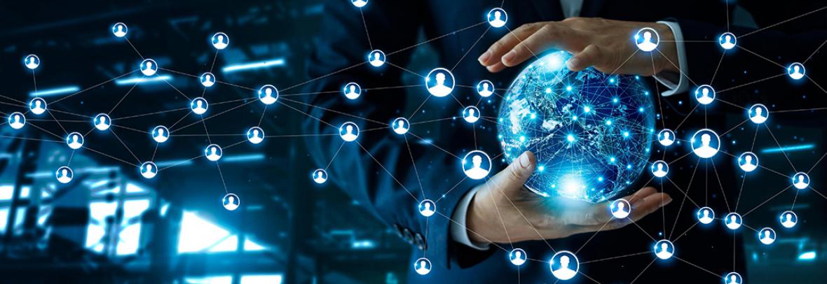 Photo illustration of a business man holding a blue globe with floating people shapes