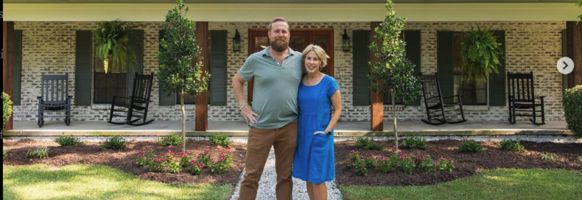 ben and erin napier standing in front of a house