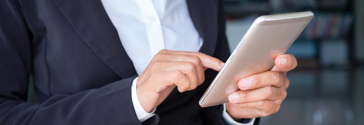 business woman's hands holding a smartphone