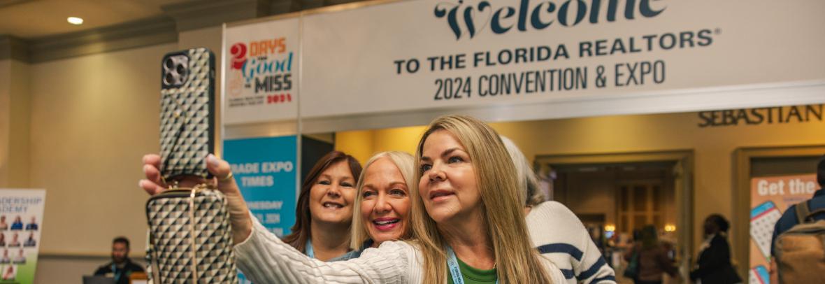 women taking a selfie at Florida Realtors convention