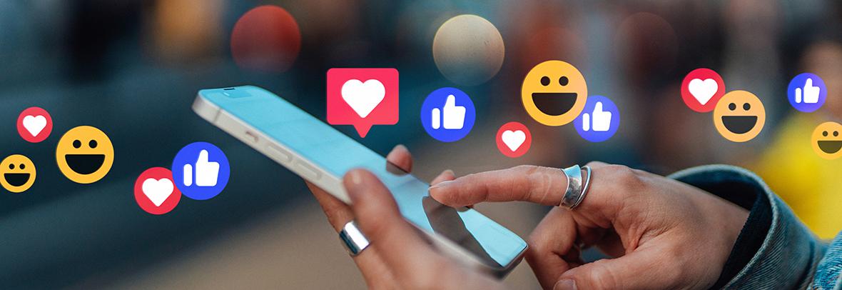 photo illustration of hands holding a phone with like emojis floating above