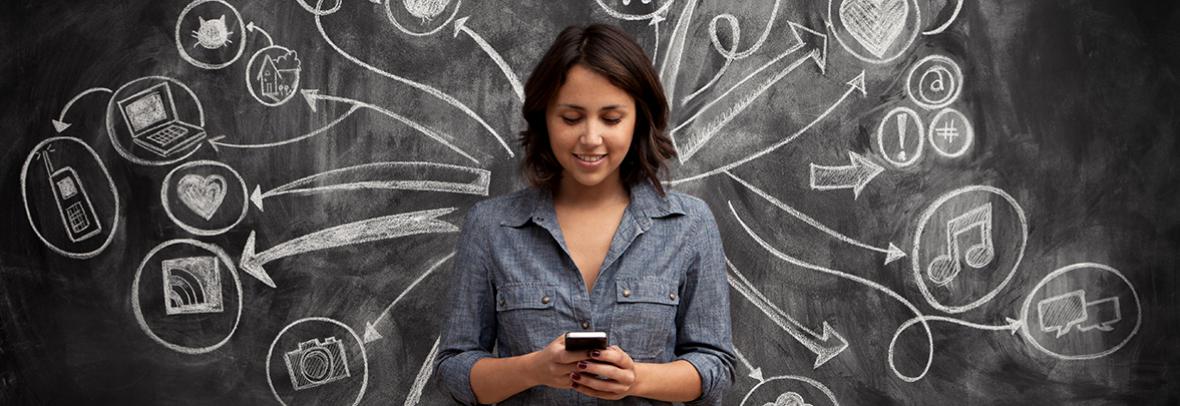 photo of woman infront of a chalkboard with social media symbols