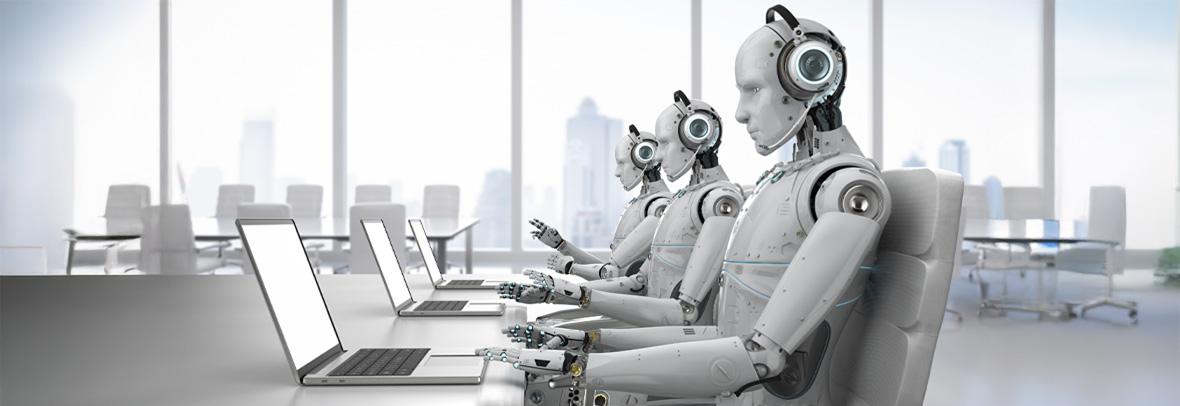 Line of robots sits in front of laptops with phones to their ears
