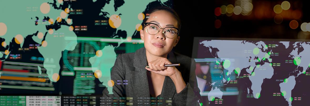 Photo illustration of an asian woman looking up at continents projected on wall