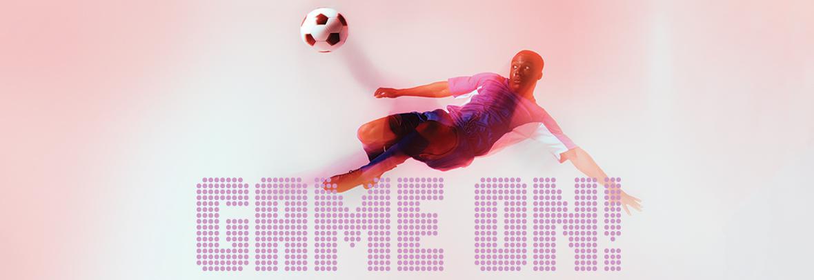 photo of soccer play kicking the ball with Game On! text overlapping