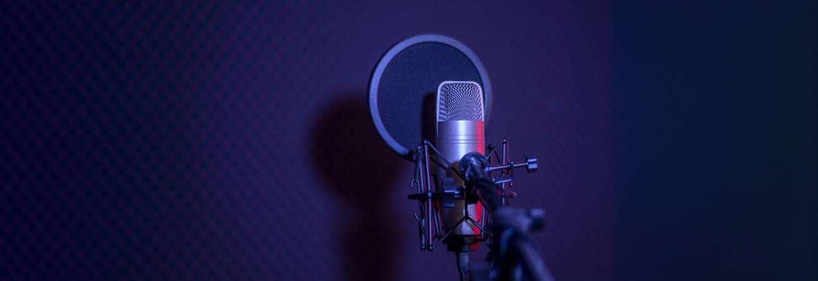 photo of microphone on purple background