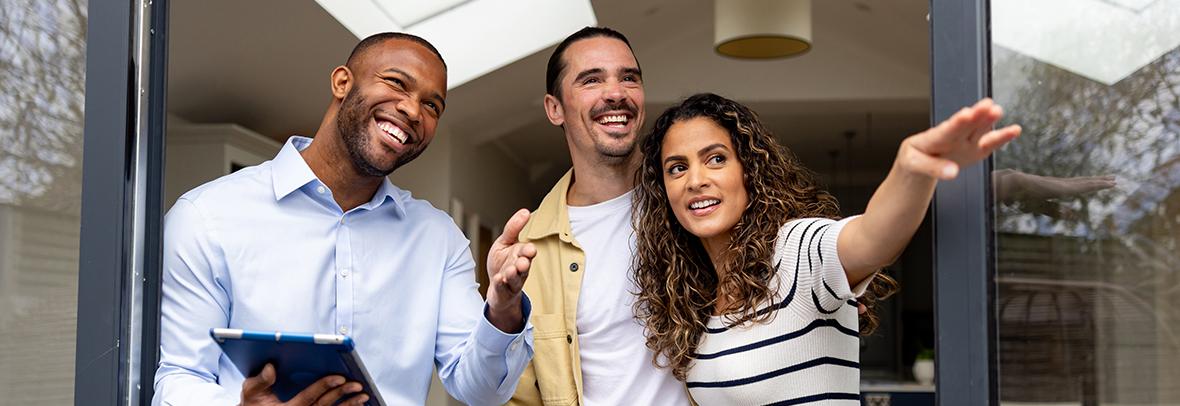 Real estate with young couple looking at a property