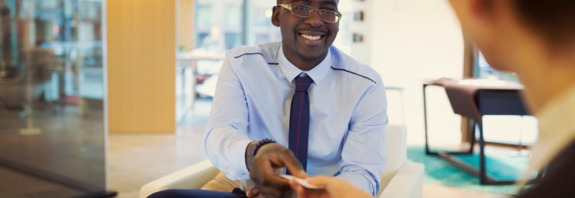 man giving out his business card