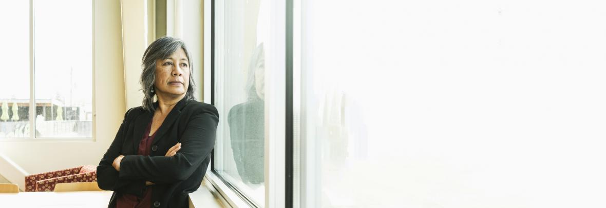 realtor looking out a window